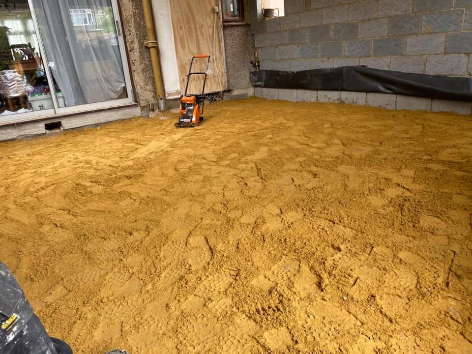 Compacted sand blinding across the extension footprint